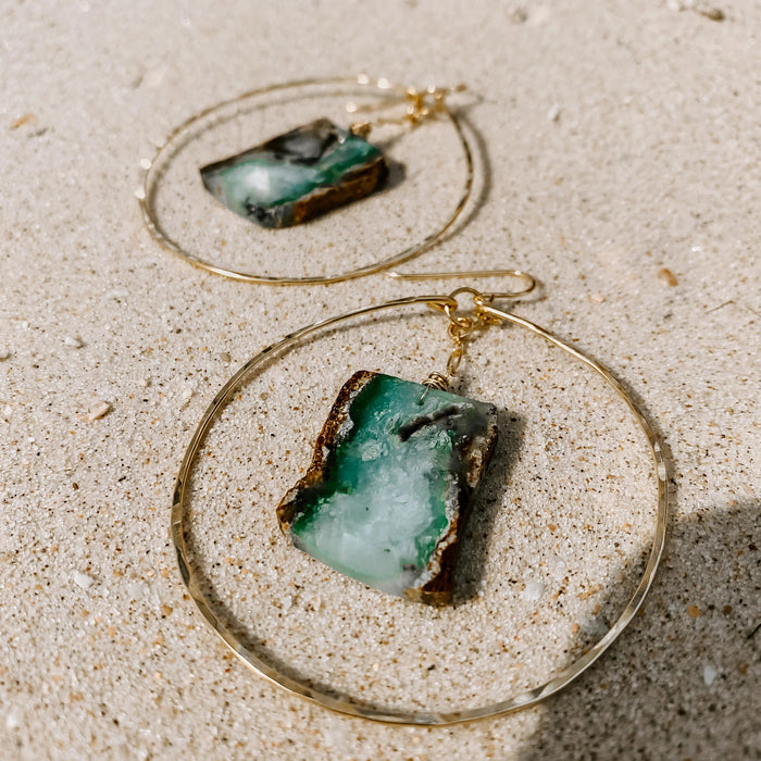 Coastline Hoop Earrings in 14k gold fill, styled on pale sand at the beach