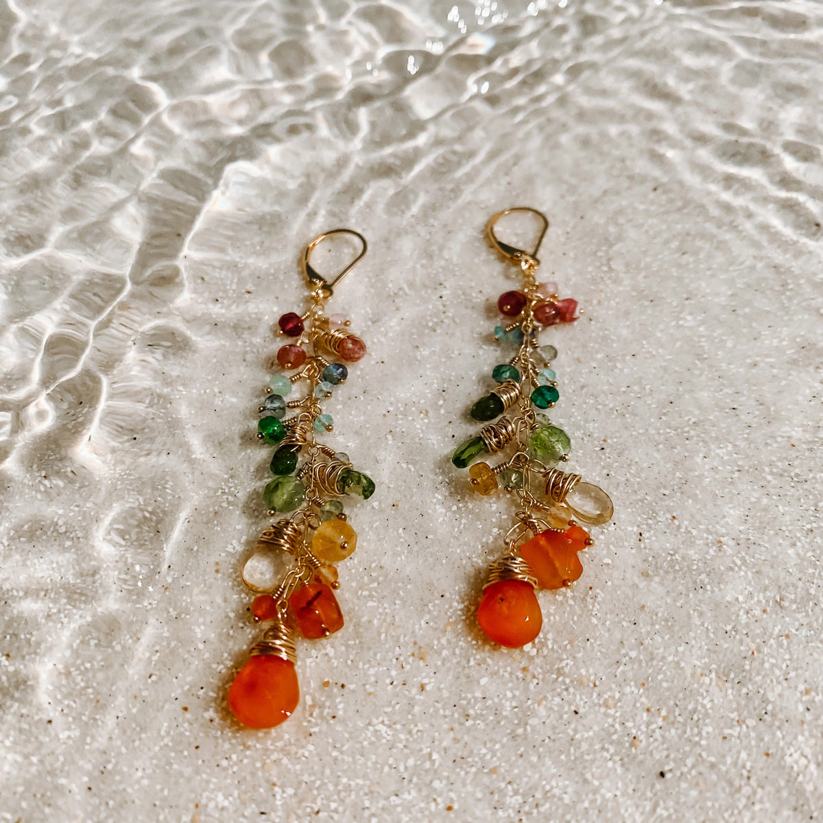 Coral Garden Earrings in 14k gold fill, styled on pale sand at the beach