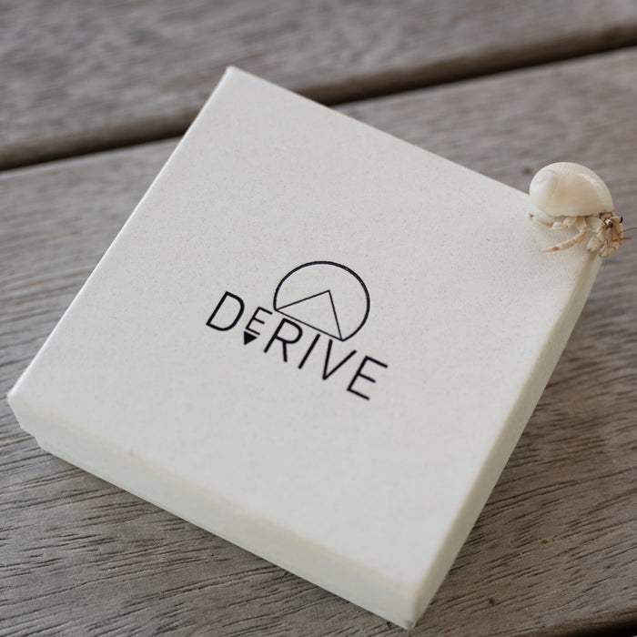 Derive Jewelry Gift Box photographed in Bora Bora with a hermit crab on the corner