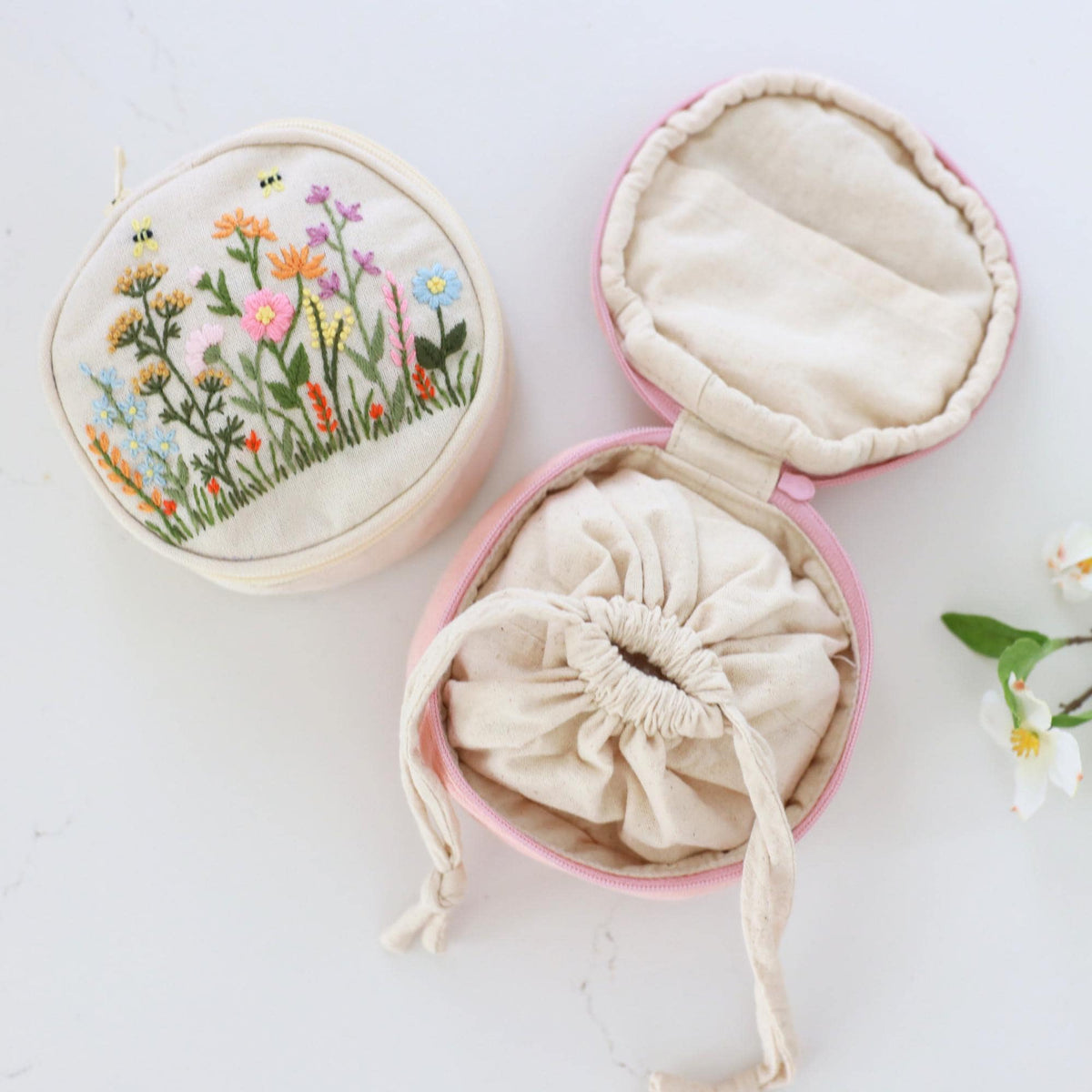Hand embroidered jewelry pouch open, showing the drawstring inner pouch