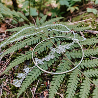 Enchanted Herkimer Diamond Necklace in sterling silver with dangling herkimer diamond quartz crystals, on fern fronds
