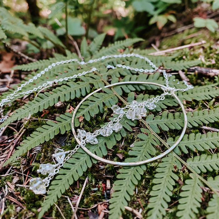 Enchanted Herkimer Diamond Necklace in sterling silver with dangling herkimer diamond quartz crystals, on fern fronds