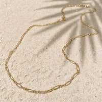 Everyday Layering Chain Necklace in 14k gold fill, styled on pale sand at the beach