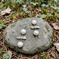Moonlight Pearl Earrings in 14k gold fill with round and stick freshwater pearls, styled on a stone