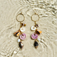 Shoreline Shells Earrings in 14k gold fill, styled on pale sand at the beach