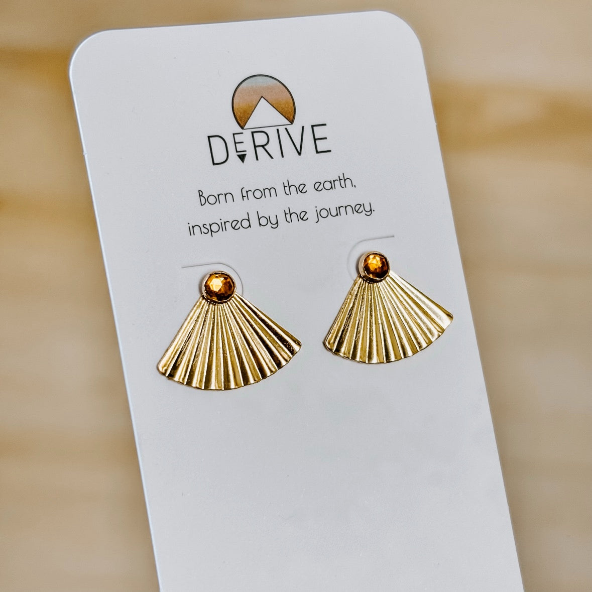 Sunset Citrine Ear Jacket Earrings in 14k gold fill with pleated fan jackets and faceted citrine studs, front view on a Derive earring card
